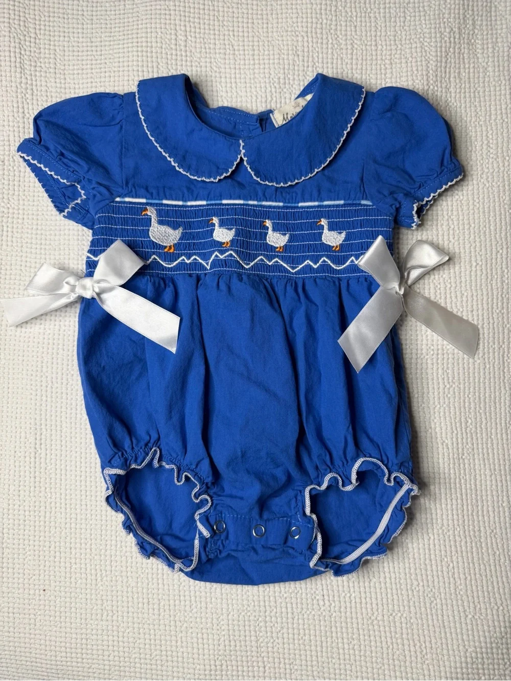Smocked Royal Blue One-Piece Romper with White Satin Bows